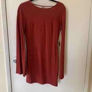 Classy dark rust dress with fun back. Tags still on.